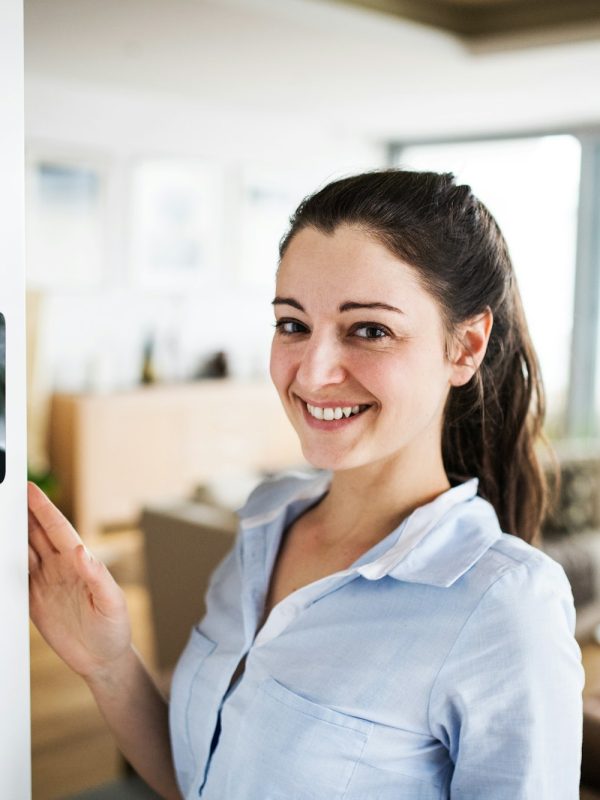 a-woman-looking-at-tablet-with-smart-home-screen-.jpg