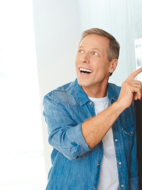 excited-handsome-man-using-smart-home-control-panel.jpg